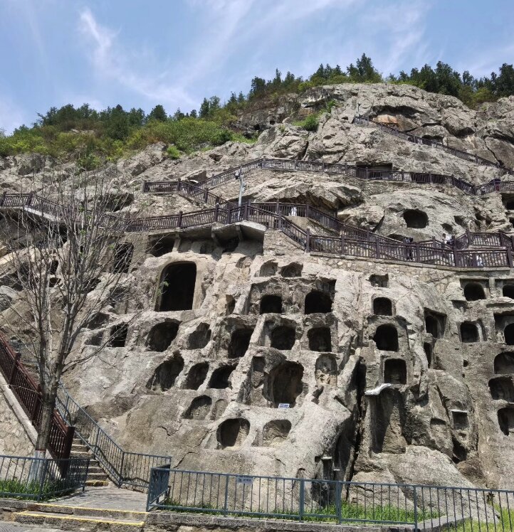 Rows of Buddhist cave carvings at the Longmen Grottoes